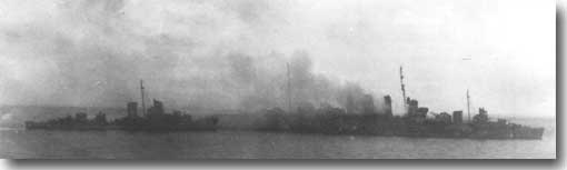 Canberra on fire August 9 1942. US destroyers Patterson and Blue stand by