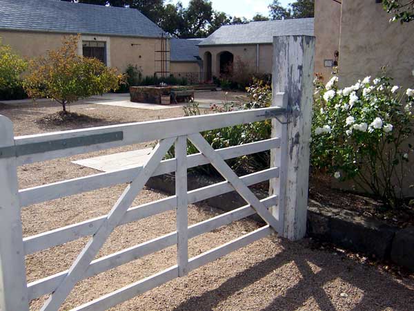 Looking into the Grovedale Olives Courtyard over the farm gate