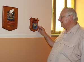 Fr Hilder examines some of the US ships’ plaques in the American chapel.