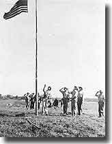 Raising the US colours on Guadalcanal after the initial landings on the 7th. of August 1942.