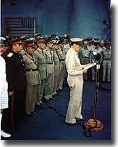 General MacArthur reads his speech at the formal Japanese surrender ceremony aboard Missouri, Tokyo Bay, 2nd. of September 1945.