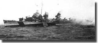 USS Heerman makes smoke in an attempt to screen the Jeep carriers, although damaged she survived