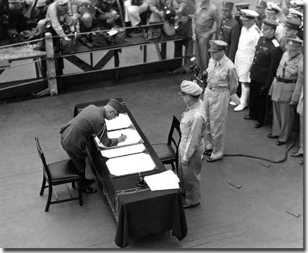 General Yoshijiro Umuzu Chief of the Japanese Army General Staff signs the Instrument of Surrender. USS Missouri, Tokyo Bay, 2nd. of September, 1945.