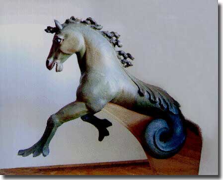 A Seahorse Figurehead in the Piran Maritime Museum, in Slovenia, it is 110 by 140 by 58 centimetres, and painted dark green and brown.