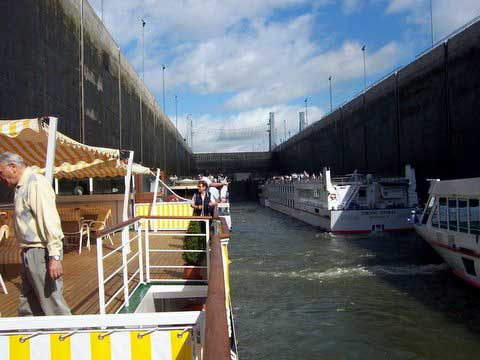 4 river ships in a lock on Danube