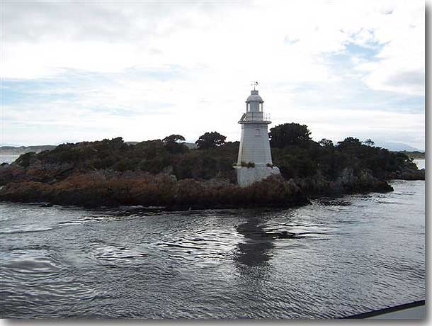 The lighthouse at Hell's Gate, the only entrance, 70 meters wide, to the huge, almost landlocked Macquarie Harbour on the West coast of Tasmania